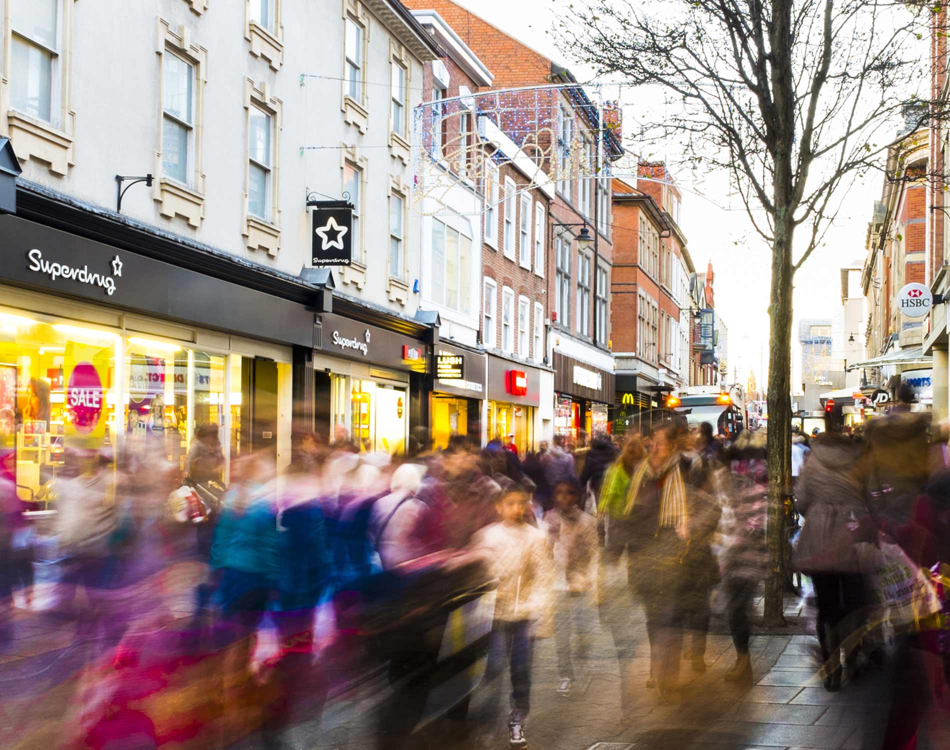 Shoppers hurry past in post-Christmas sales